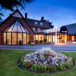 Exterior shot of the front of the mercure hull grange park hotel at dusk