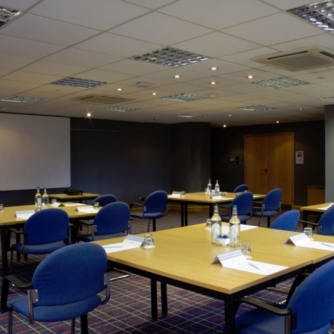 Table set for a meeting in city of culture room at mercure hull grange park hotel