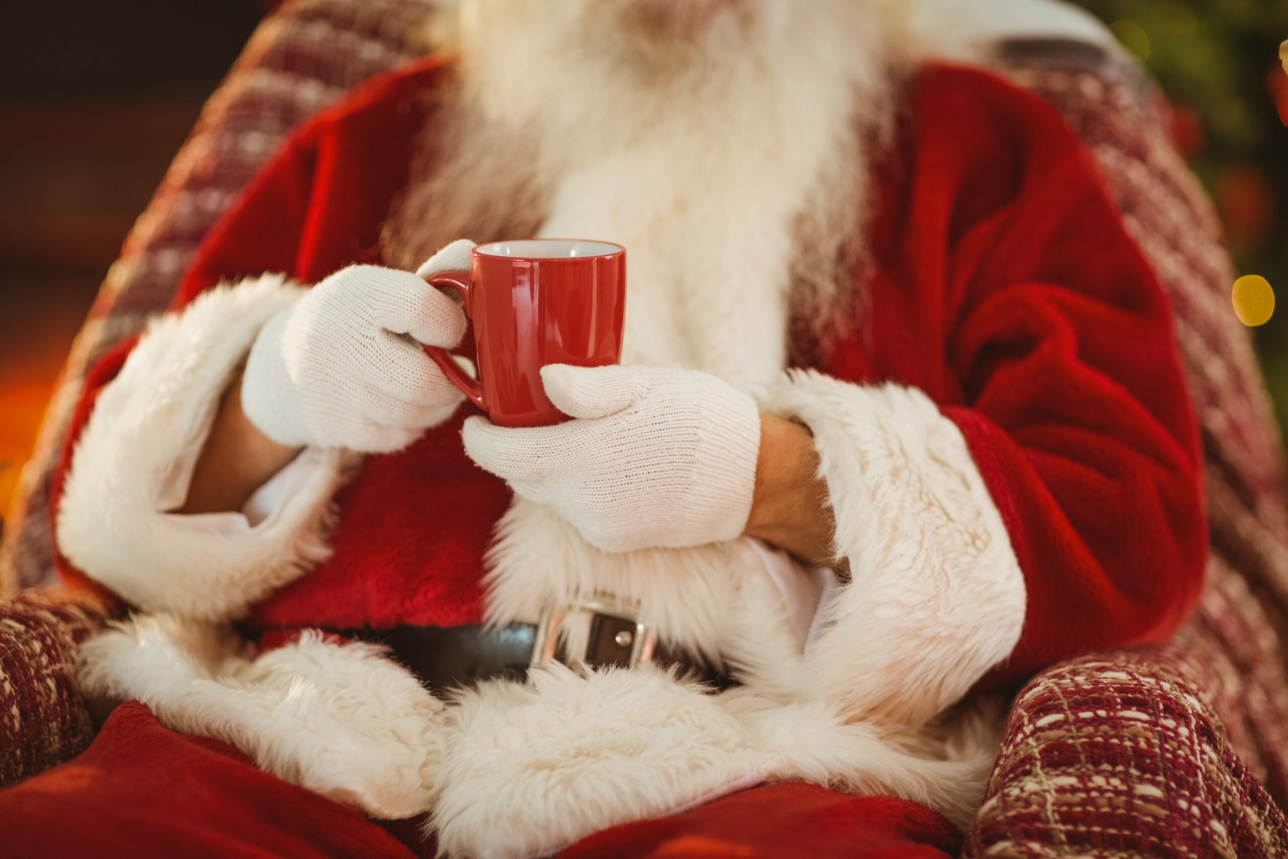 Mid,Section,Of,Santa,Holding,Hot,Drink,At,Home,In Afternoon Tea at Mercure Manchester Piccadilly Hotel