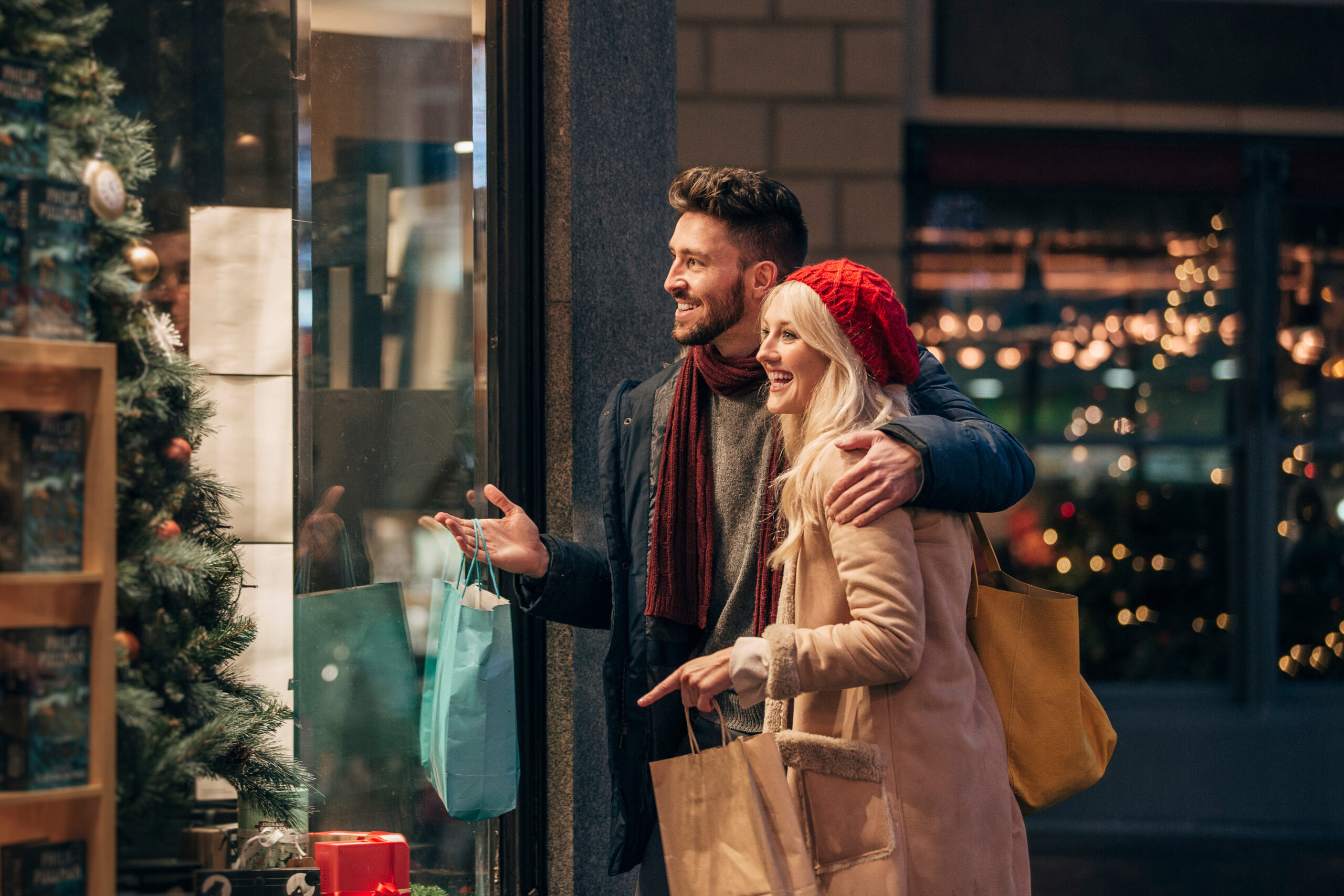 Side,View,Of,A,Couple,Doing,Some,Window,Shopping,At Couple christmas shopping